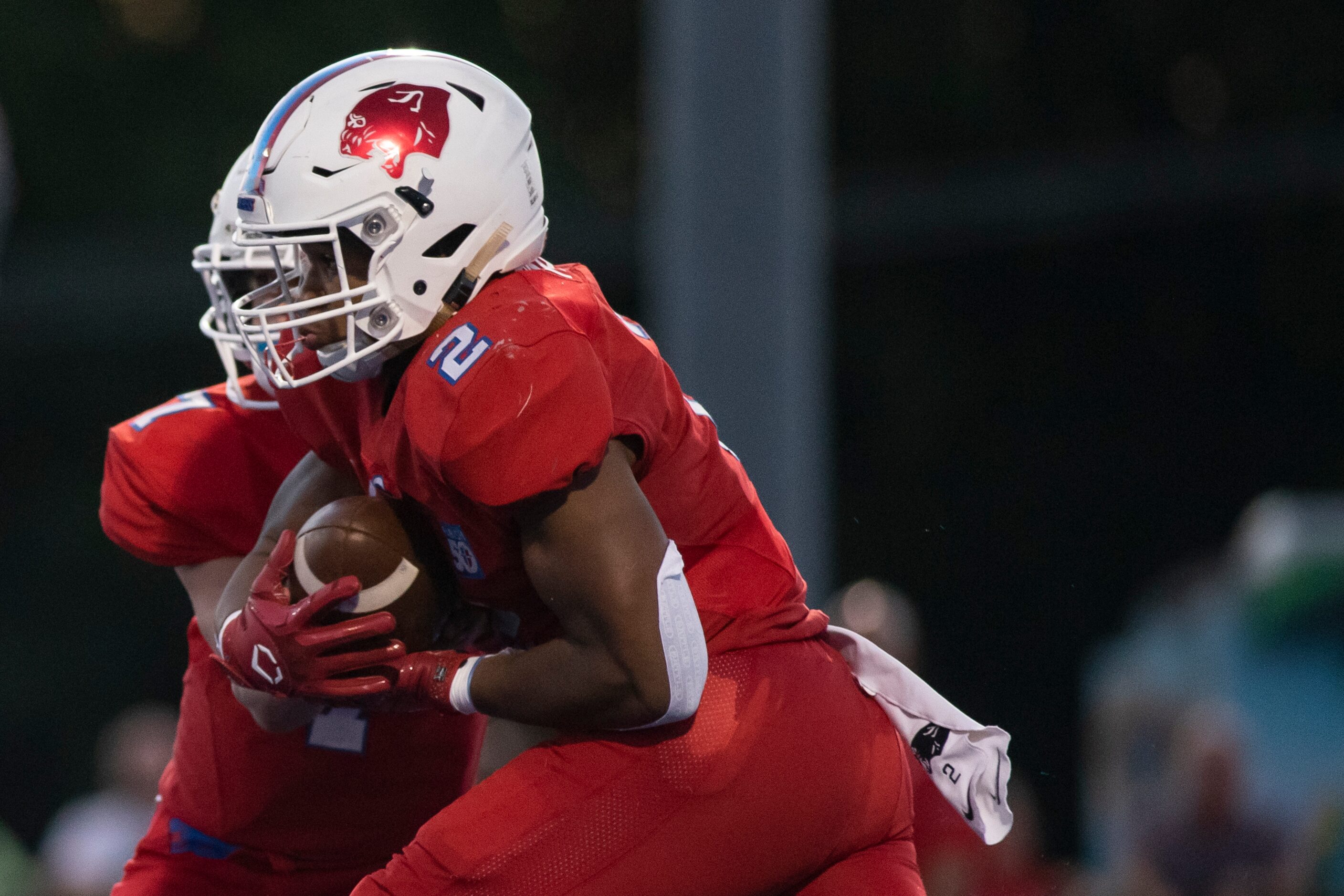 Parish Episcopal senior Andrew Paul (2) grabs the hand off from Parish Episcopal freshman...