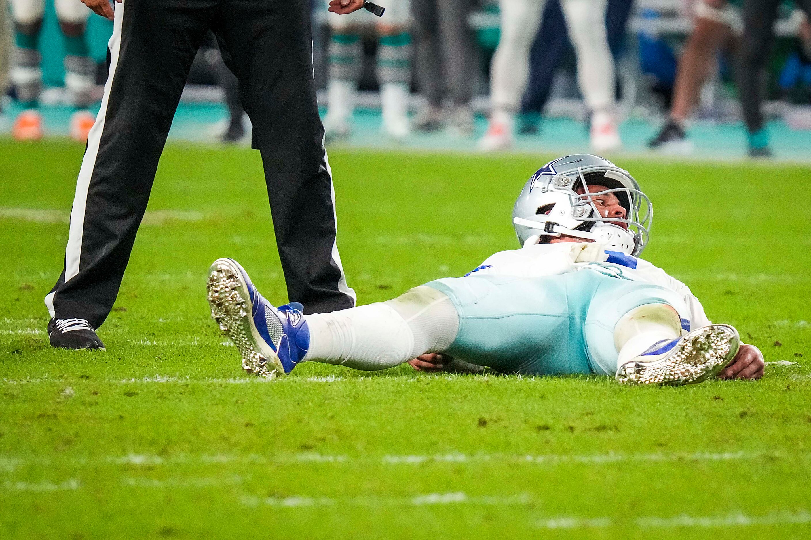 Dallas Cowboys quarterback Dak Prescott (4) looks up from the turf after throwing a...