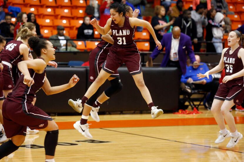 Plano's Payal Elete (31) rushes the court with teammates after they defeated Duncanville...