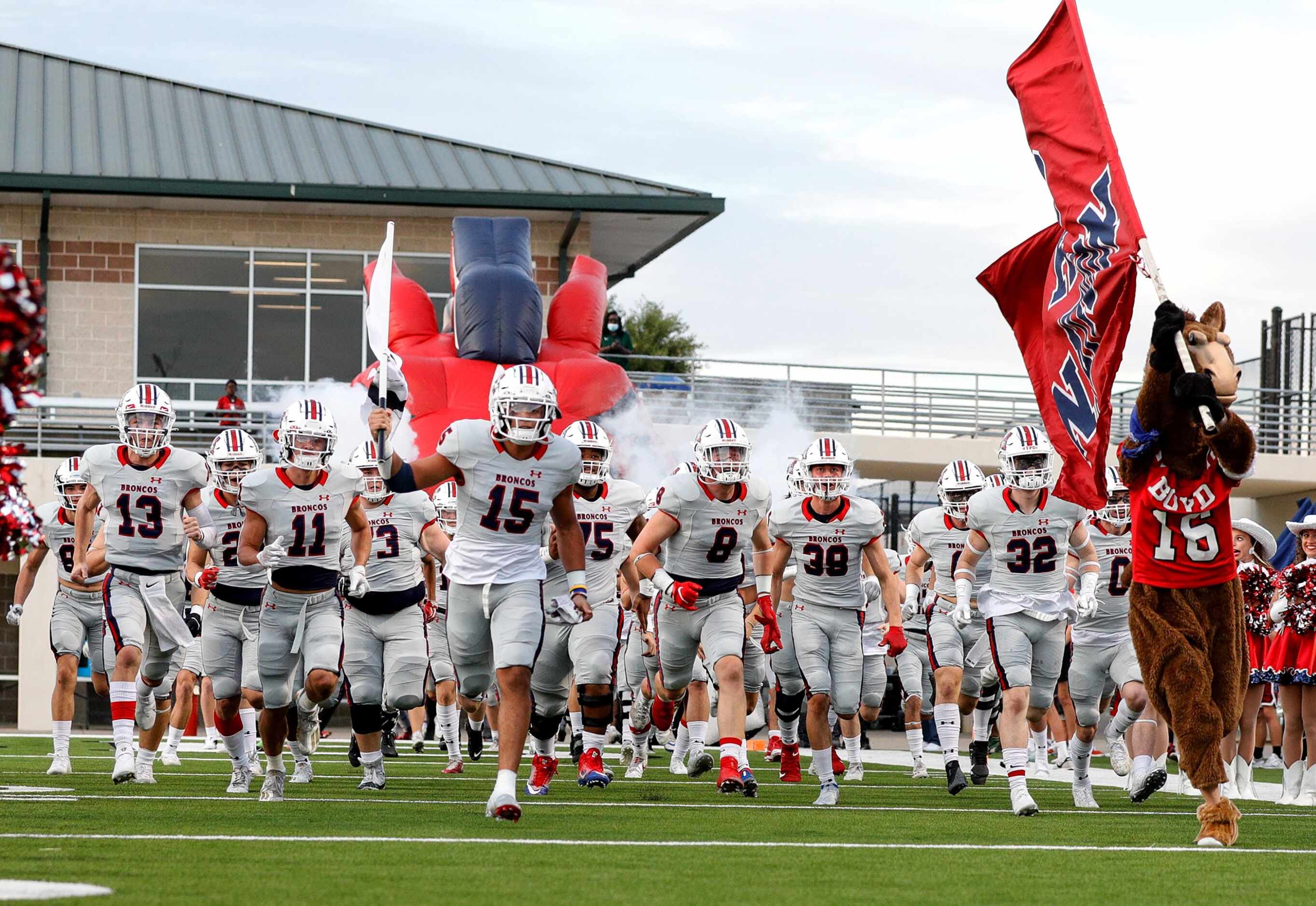 The McKinney Boyd Broncos enter the field to face Denton Braswell in a District 5-6A high...