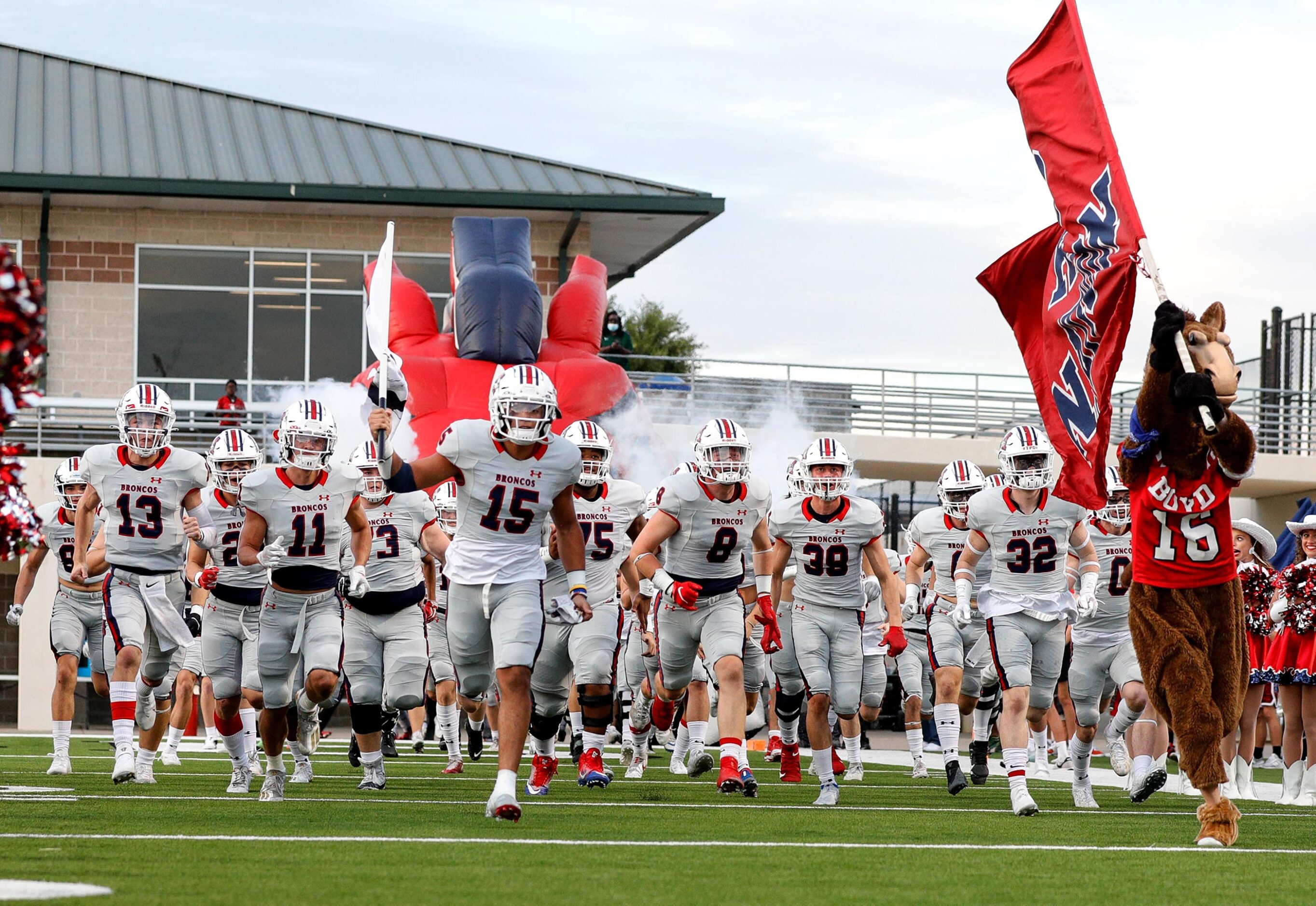 The McKinney Boyd Broncos enter the field to face Denton Braswell in a District 5-6A high...