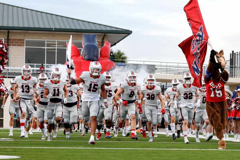 The McKinney Boyd Broncos enter the field to face Denton Braswell in a District 5-6A high...