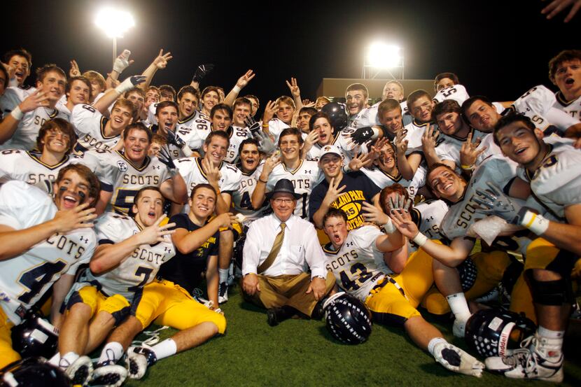 Highland Park Head Coach Randy Allen (center) celebrates his 300th career victory with the...