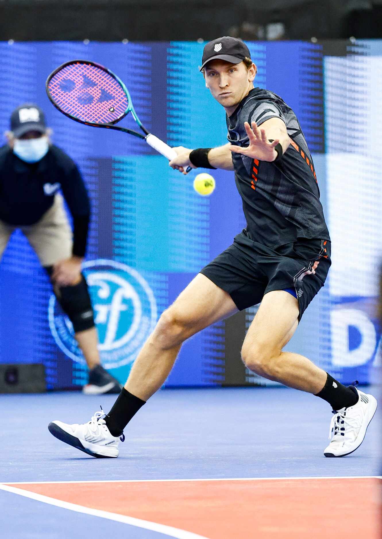 Mitchell Krueger, a Fort Worth native, returns the ball in a match against Yoshihito...