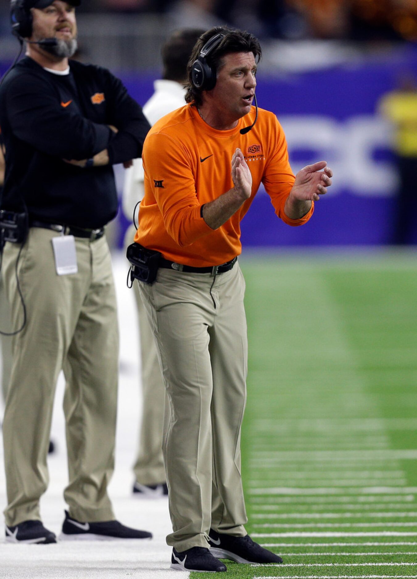 HOUSTON, TEXAS - DECEMBER 27:Head coach Mike Gundy of the Oklahoma State Cowboys looks on...