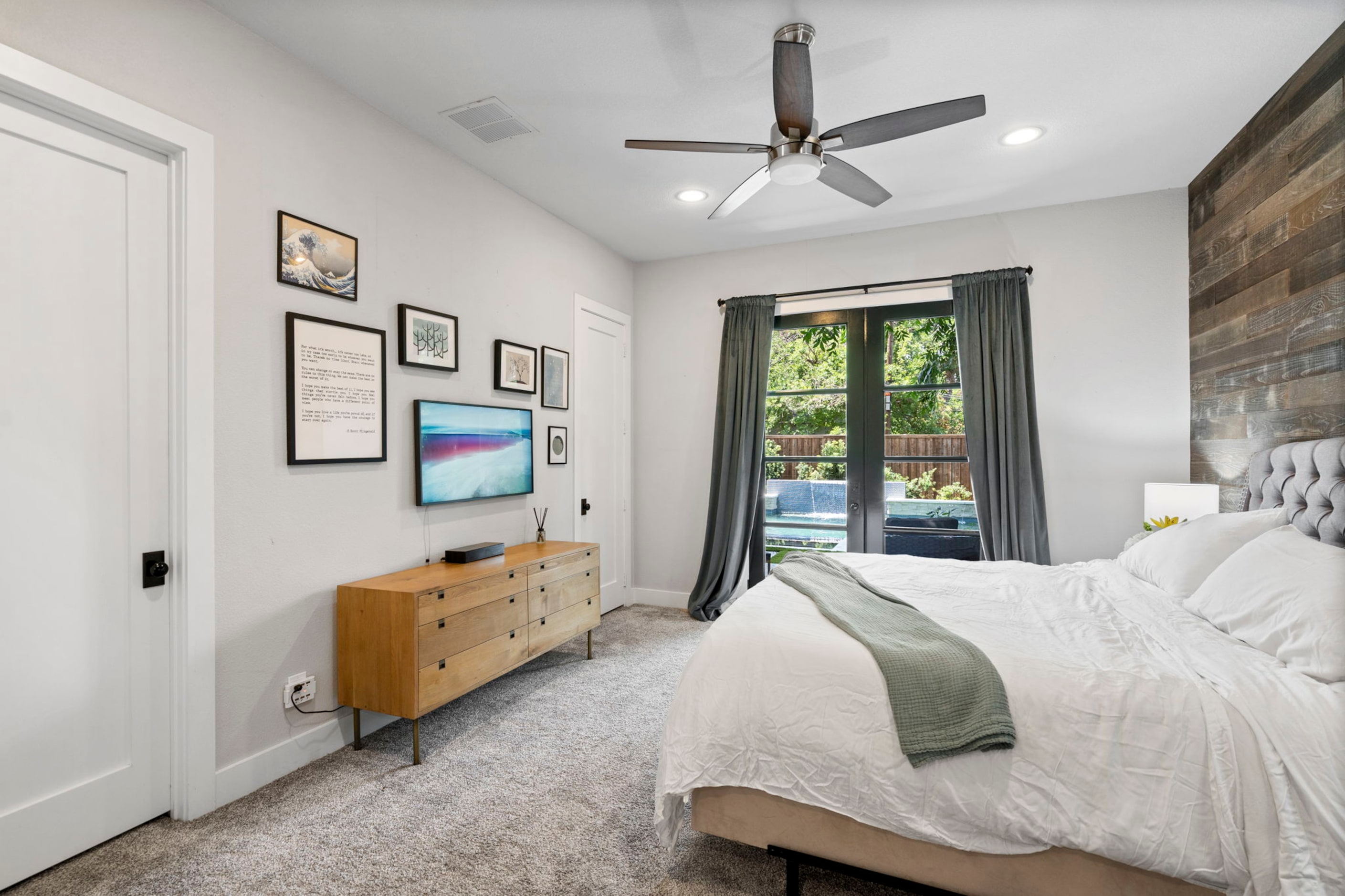 Two bedrooms, including the primary suite, are located on the first level of the home.