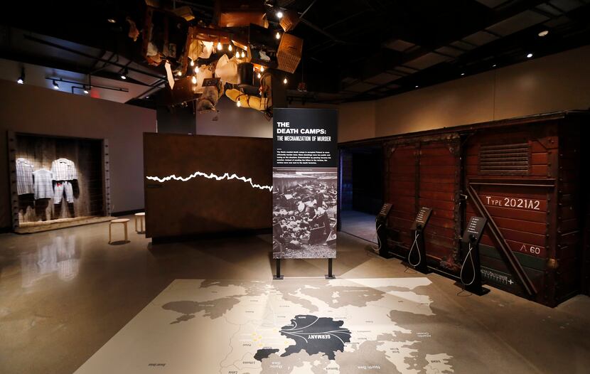 The exhibit including a refurbished German railcar (right) in the Holocaust/Shoah Wing of...