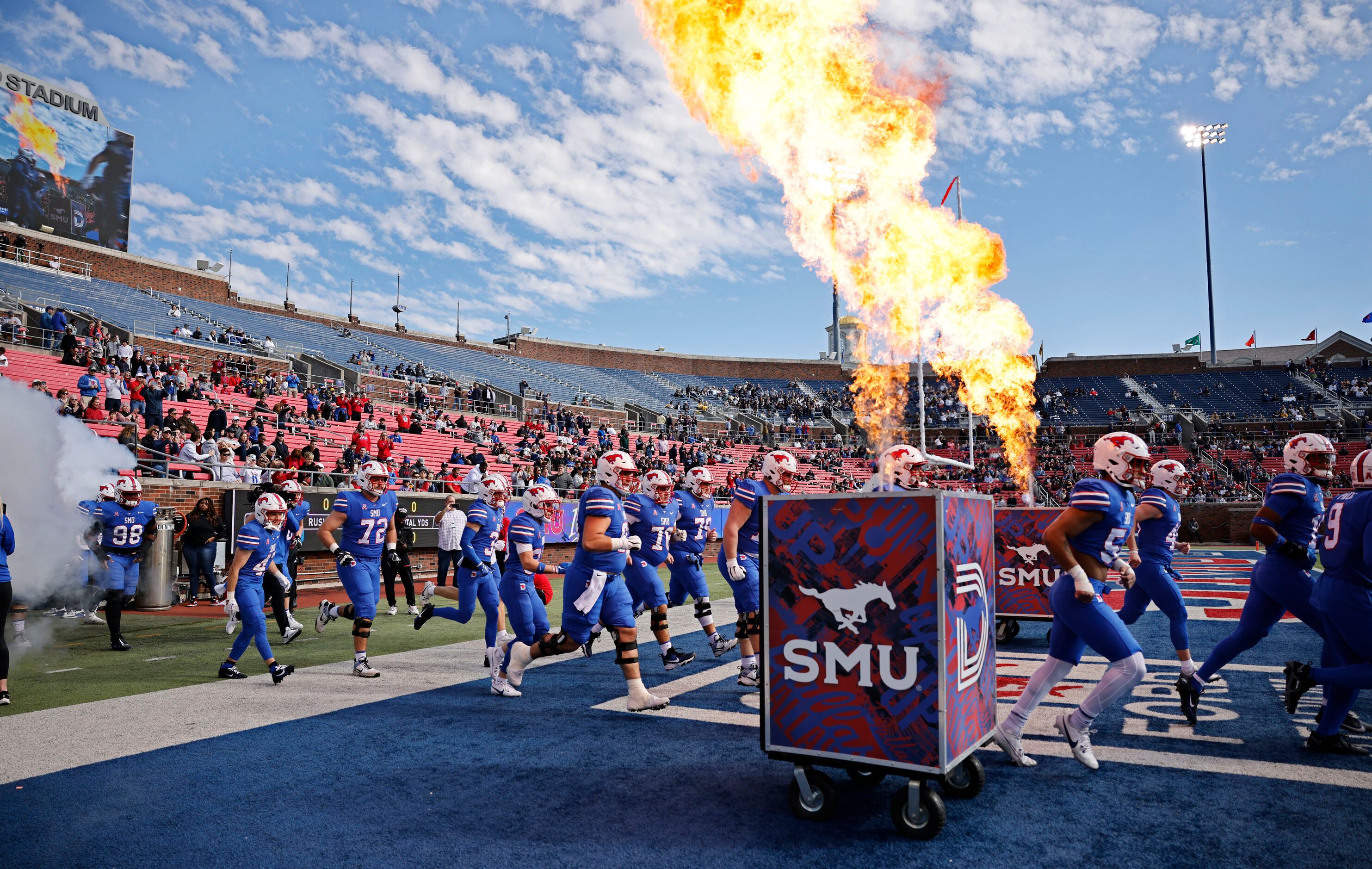 SMU players run into the field before during an NCAA college football game against the Navy...