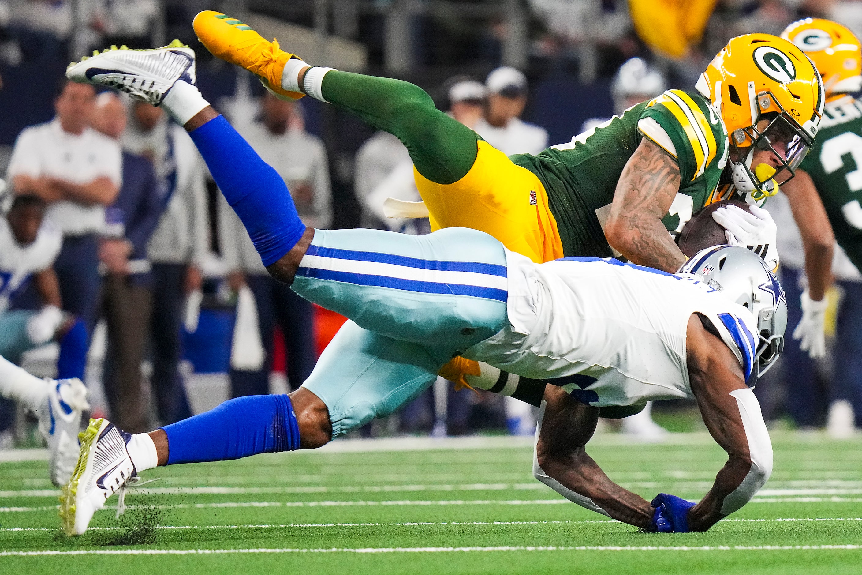 Green Bay Packers cornerback Jaire Alexander (23) intercepts a pass intended for Dallas...