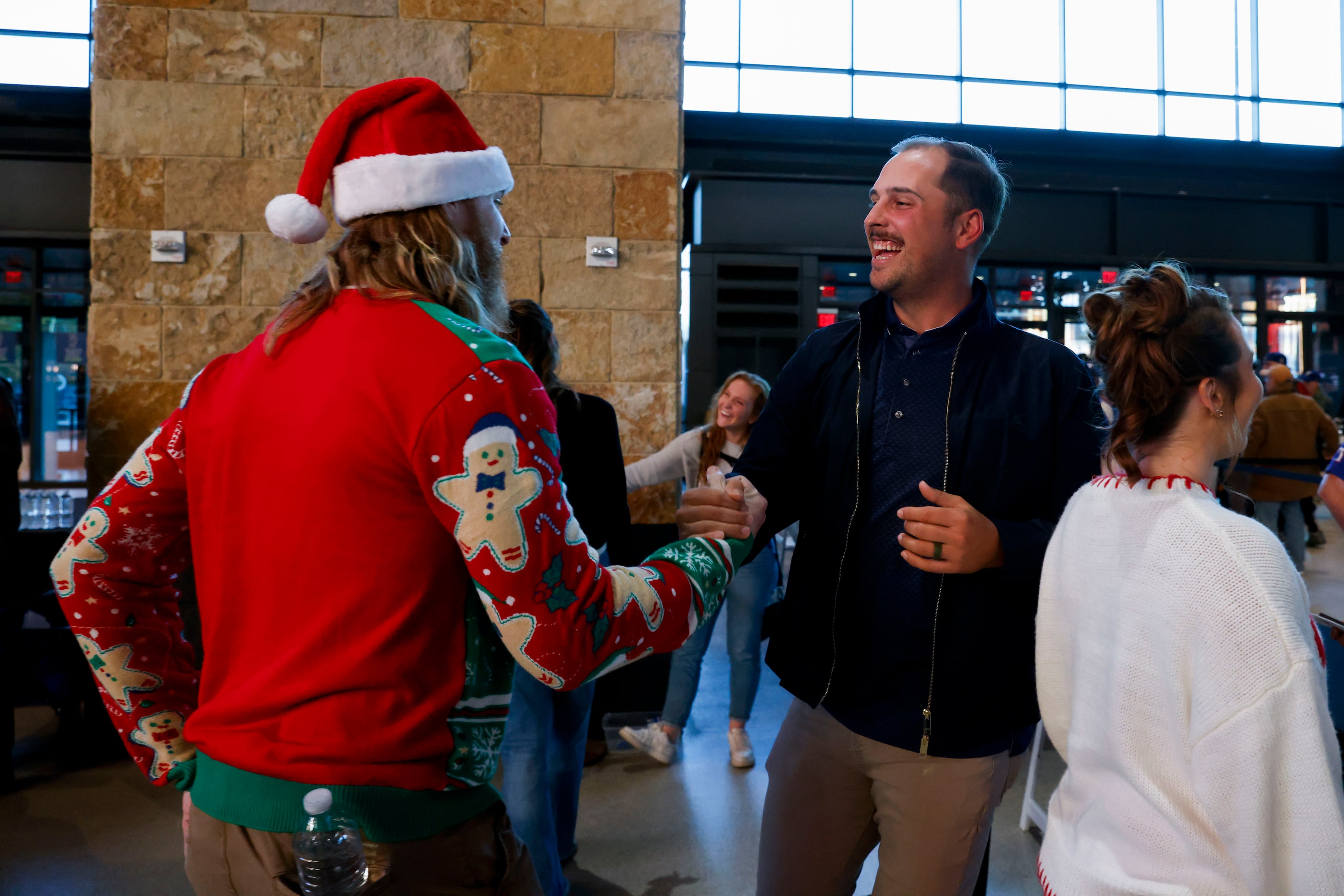 Texas Rangers pitcher Jon Gray (left) shakes hand with first baseman Nathaniel Lowe as he...