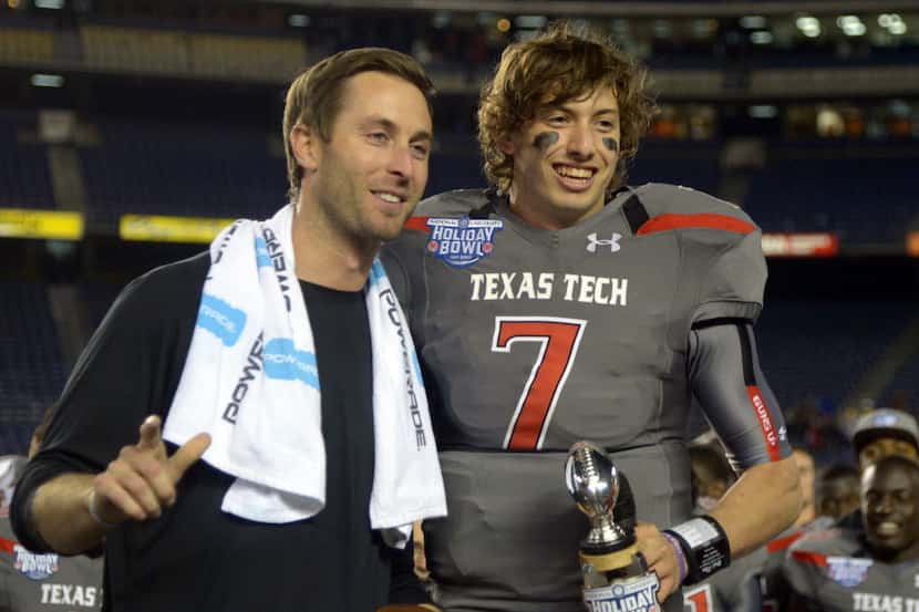 Dec 30, 2013; San Diego, CA, USA; Texas Tech Red Raiders coach Kliff Kingsbury (left) and...