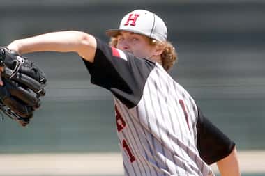 Rockwall Heath pitcher Baylor Baumann (1) delivers a pitch to a Rockwall batter during the...