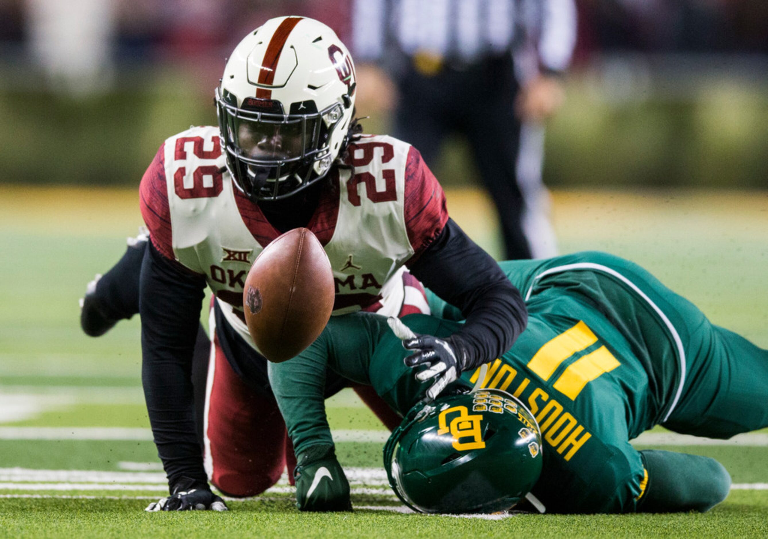 Oklahoma Sooners running back Rhamondre Stevenson (29) recovers his own fumble near Baylor...