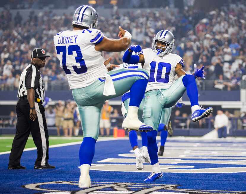 Dallas Cowboys wide receiver Tavon Austin (10) celebrates a touchdown with center Joe Looney...