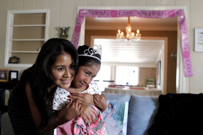 Yolanda Méndez and daughter Aidelin took time out for a photo during the girl's 7th birthday...