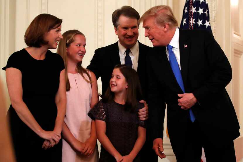 President Donald Trump talks with Judge Brett Kavanaugh his Supreme Court nominee, and his...