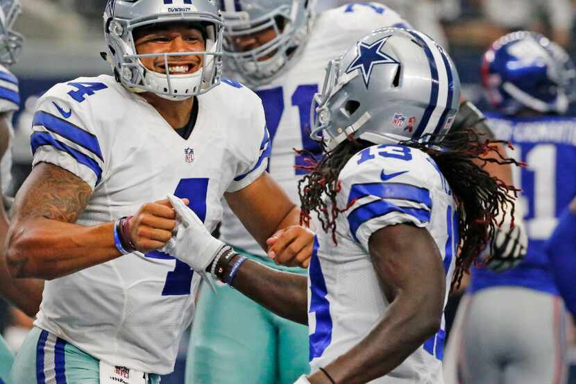 Dallas Cowboys quarterback Dak Prescott (4) is all smiles after Dallas Cowboys running back...