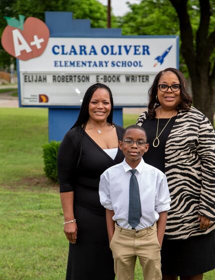 Elijah Robertson, 10, has gotten encouragement from his teacher Robin Bryan (left) and...