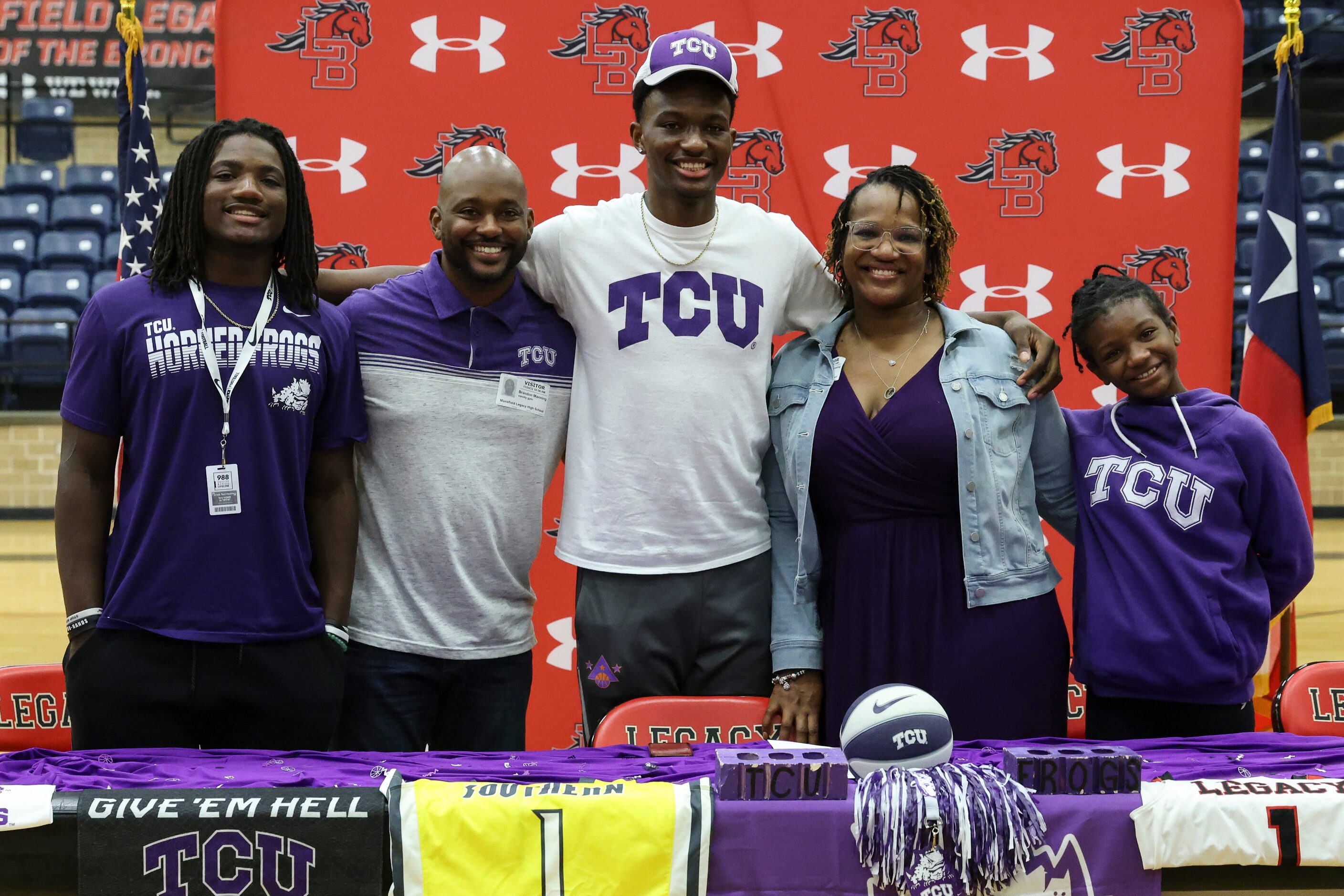 Jaden, Brandon, Isaiah, Johnjalyn, and Zuri Manning pose for a photo after Isaiah commits to...