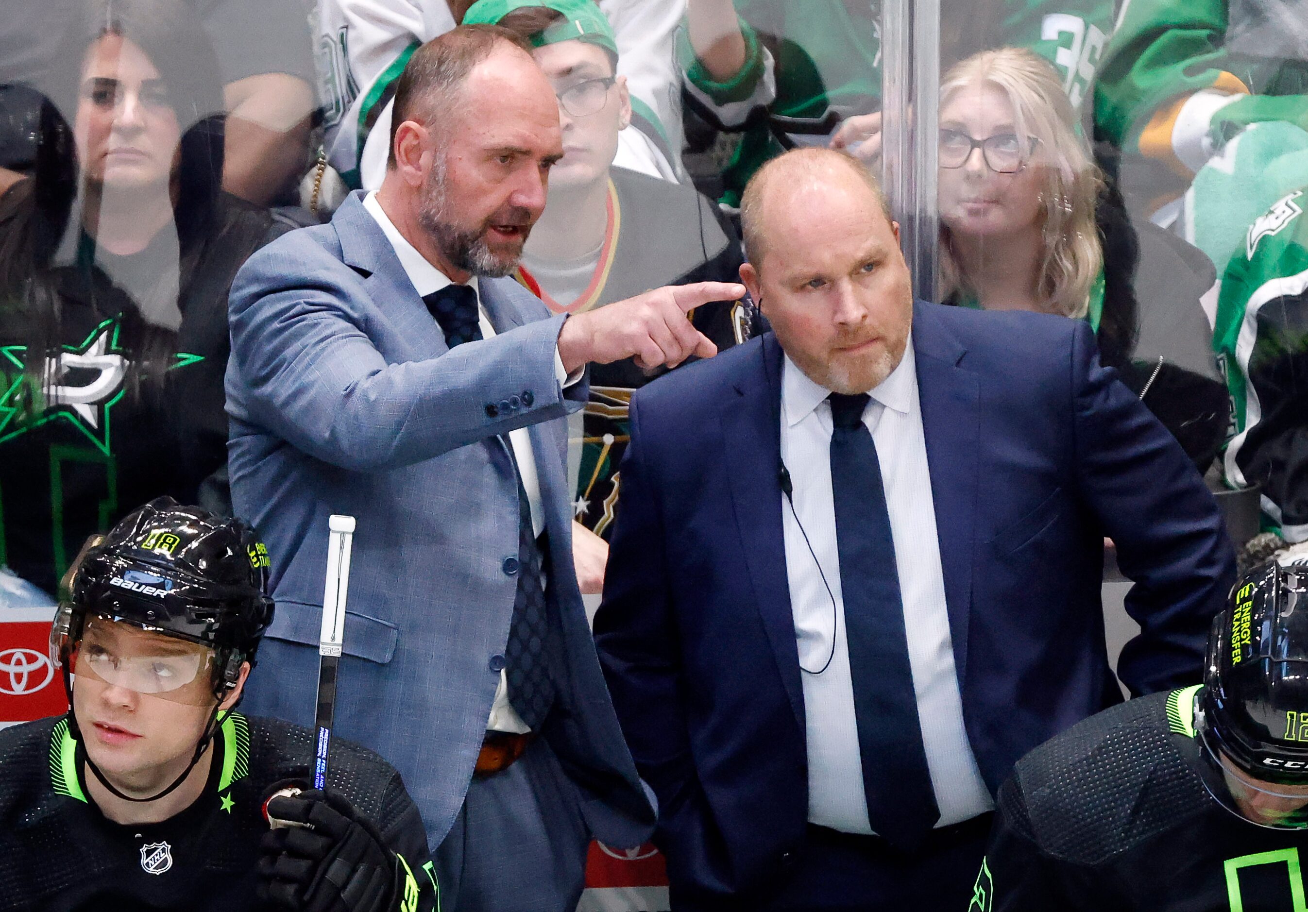 Dallas Stars head coach Pete DeBoer (left) confers with assist Steve Spott during the second...