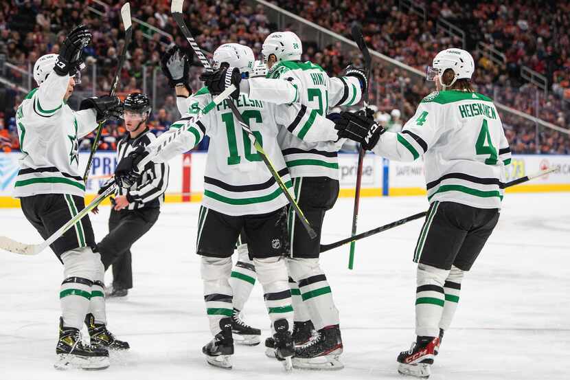 Dallas Stars players celebrate a goal against the Edmonton Oilers during first-period NHL...