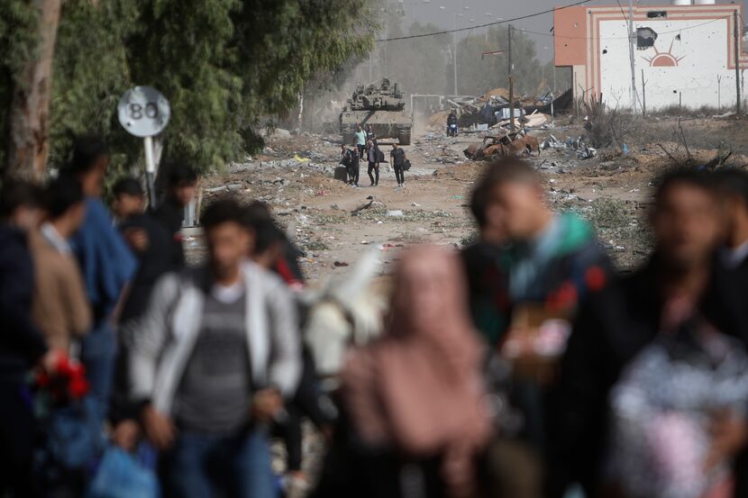 Palestinians flee to northern Gaza as Israeli tanks block the Salah al-Din road in the...