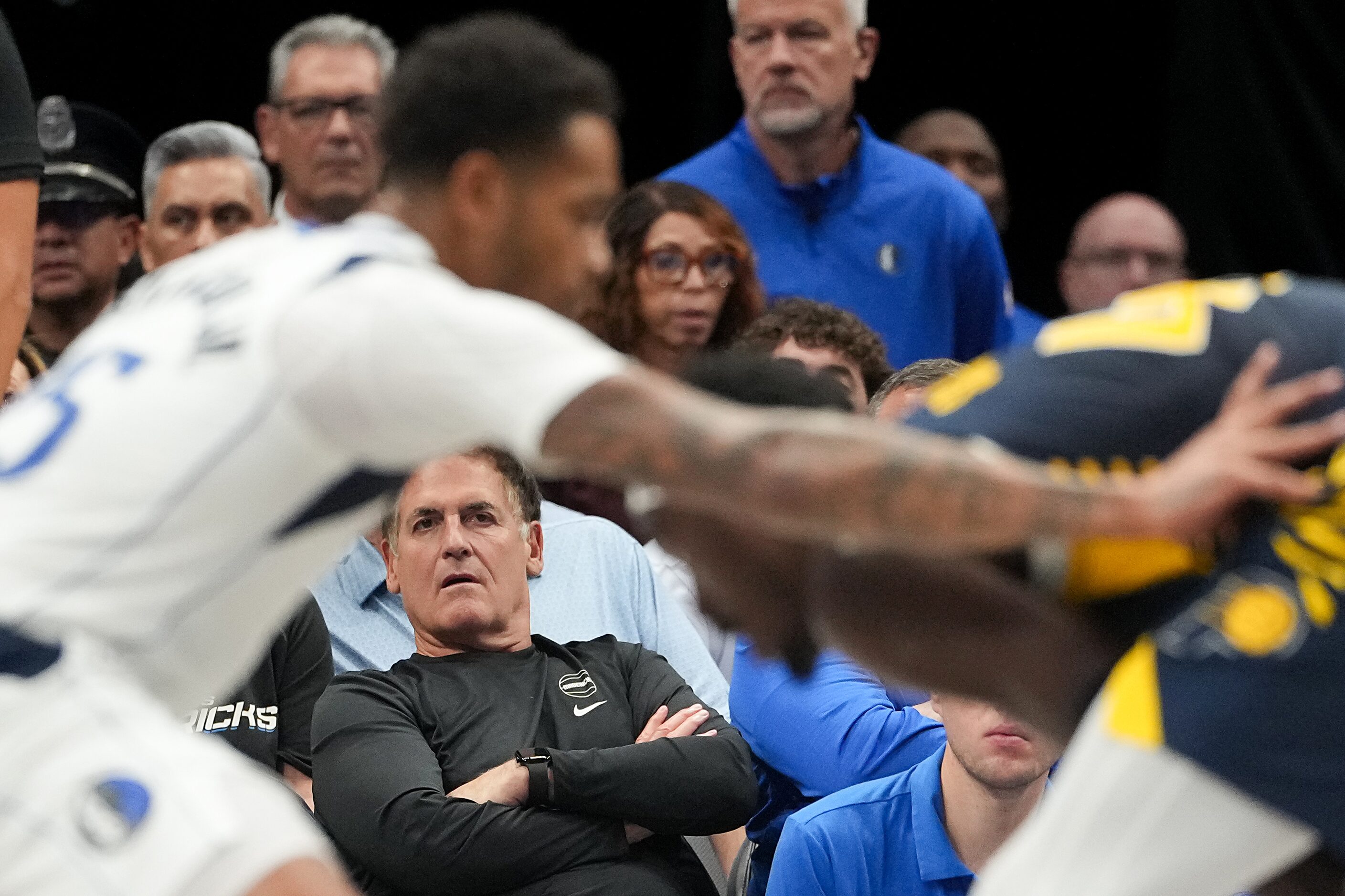 Mark Cuban watches during the first half of an NBA basketball game between the Dallas...