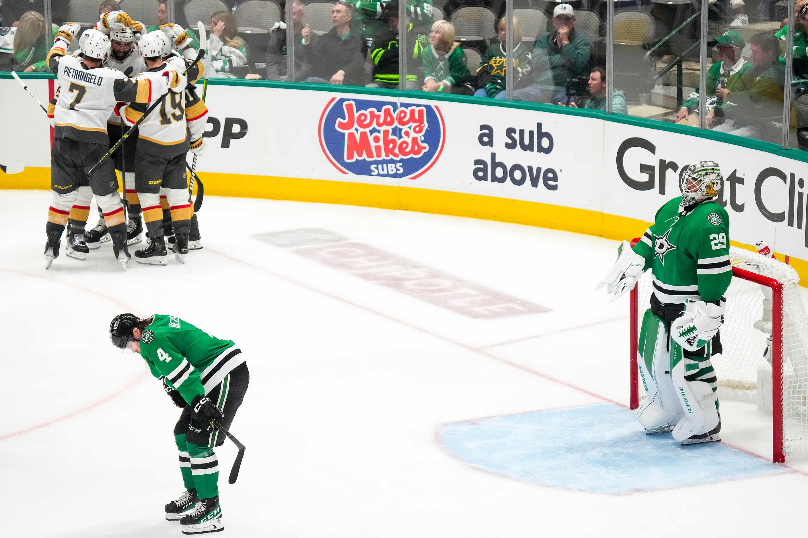 Dallas Stars defenseman Miro Heiskanen (4) and goaltender Jake Oettinger (29) look away as...