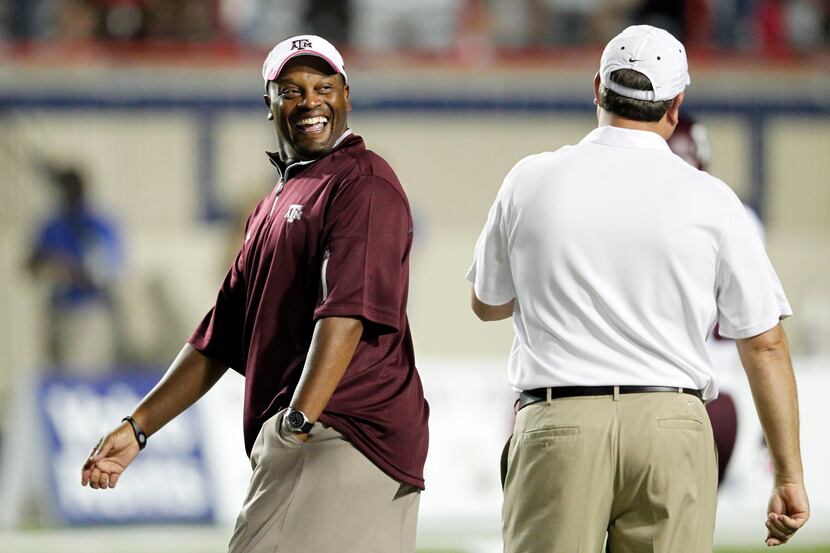 Texas A&M Aggies head coach Kevin Sumlin shares a laugh with Louisiana Tech Bulldogs head...