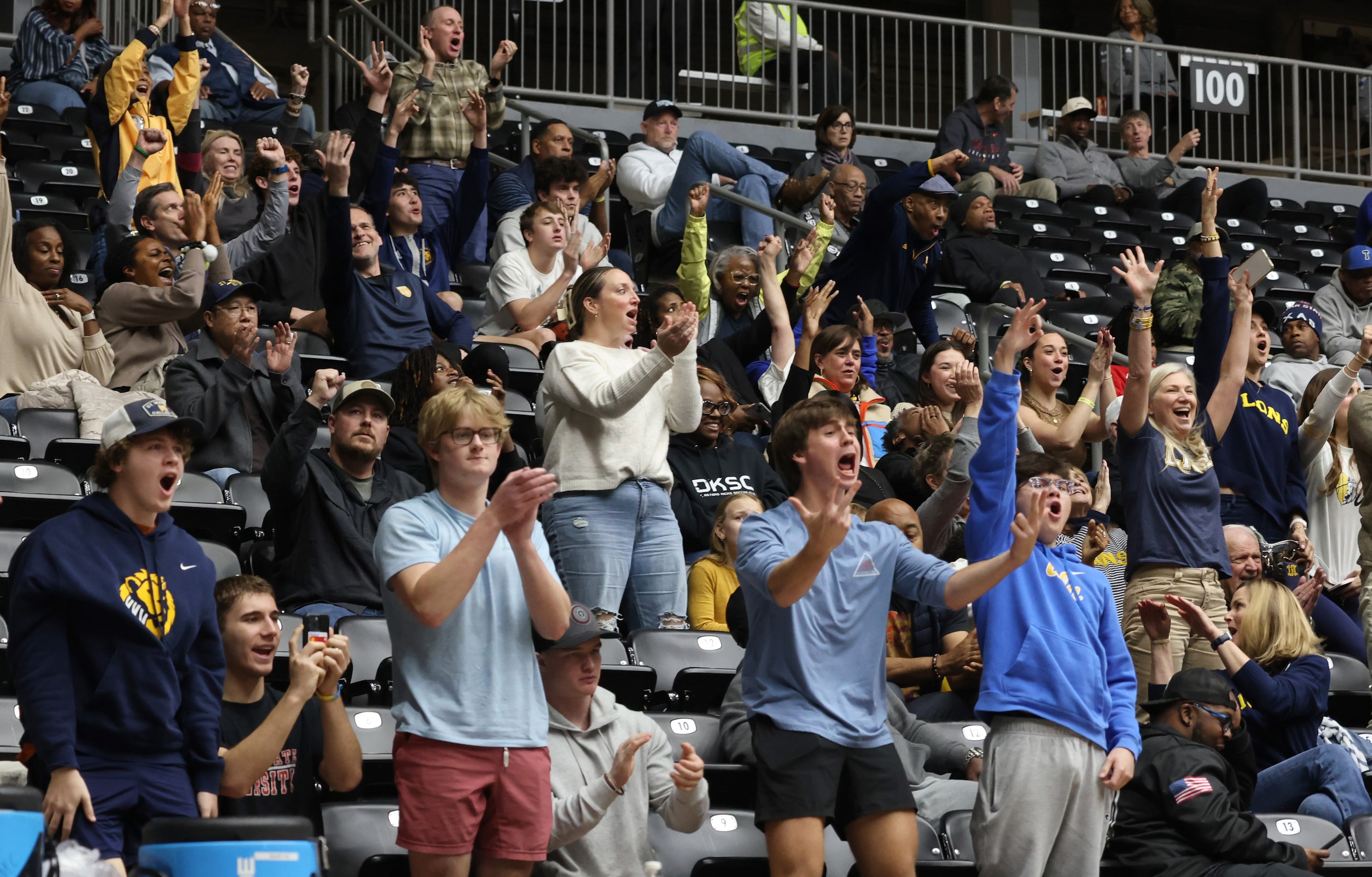 St. Mark's fans erupt as lions players come to the bench for a called timeout during second...