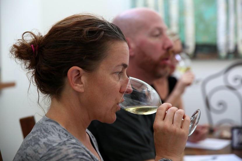 Melissa Monosoff, master sommelier, sips wine during a panel at the home of Tina Danze.