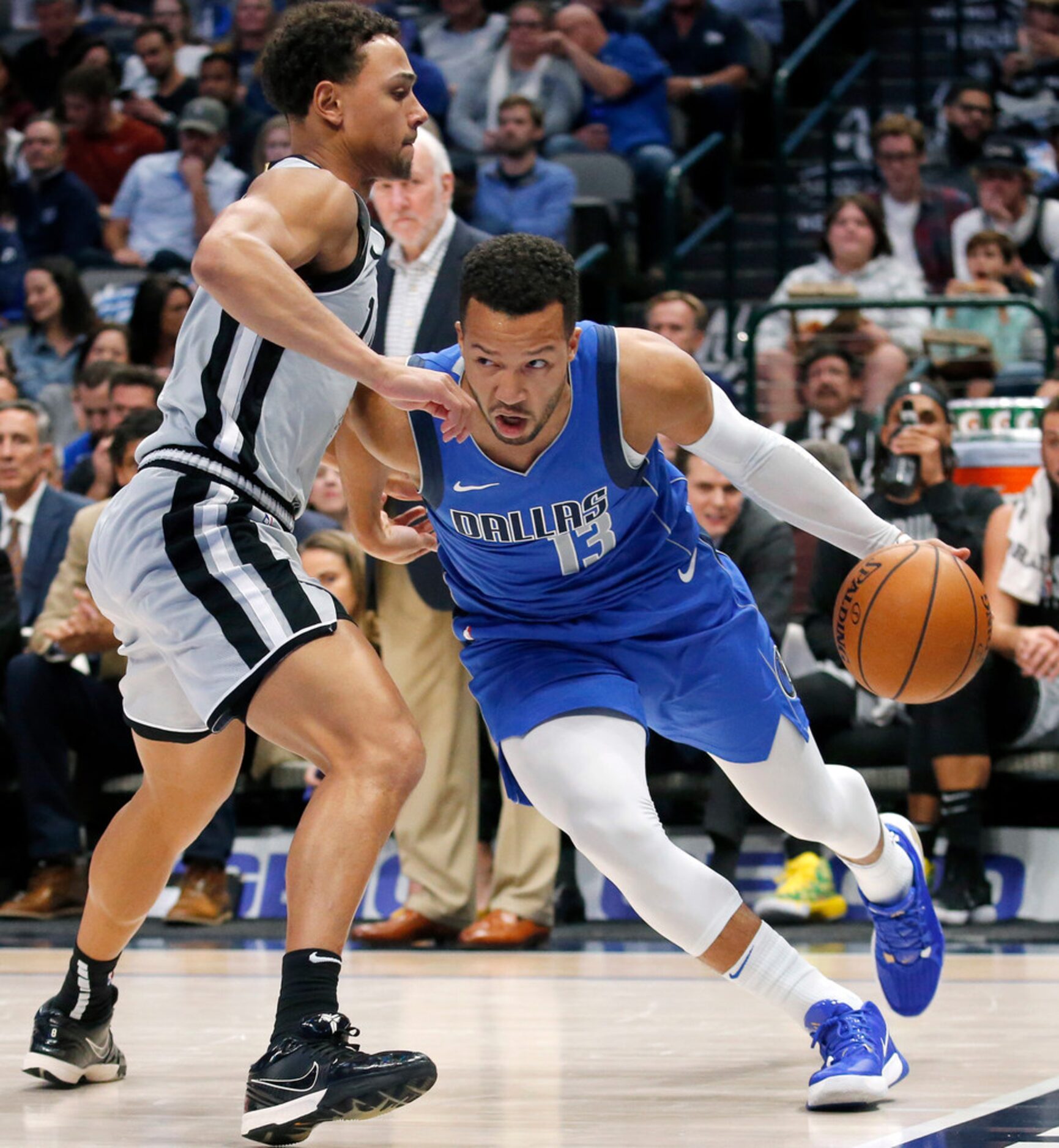 Dallas Mavericks guard Jalen Brunson (13) drives the baseline past San Antonio Spurs guard...