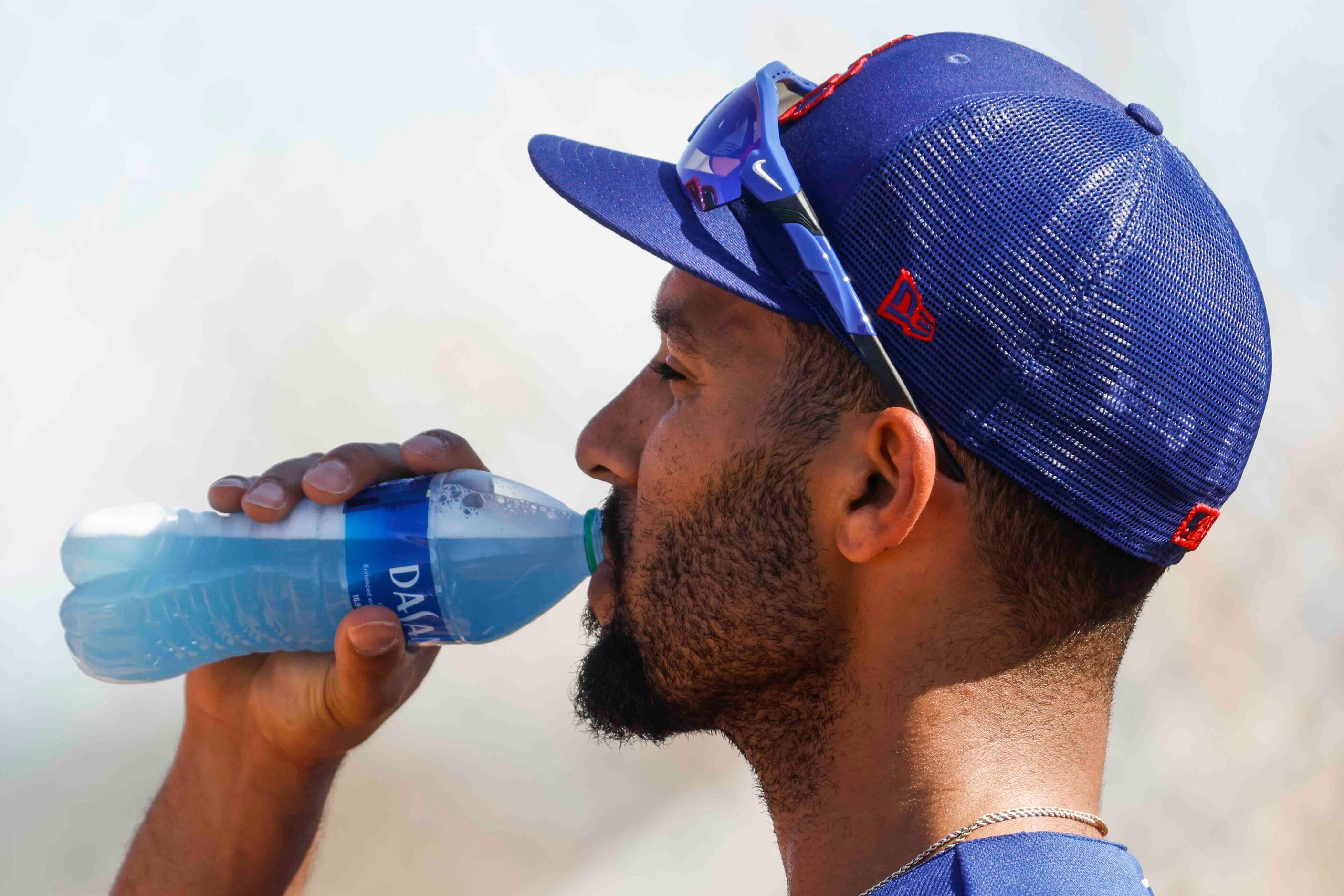 Texas Rangers second baseman Marcus Semien takes a drink in between batting practice during...