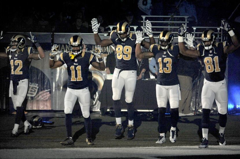 In this Sunday Nov. 30, 2014, file photo, St. Louis Rams players, from left; Stedman Bailey...