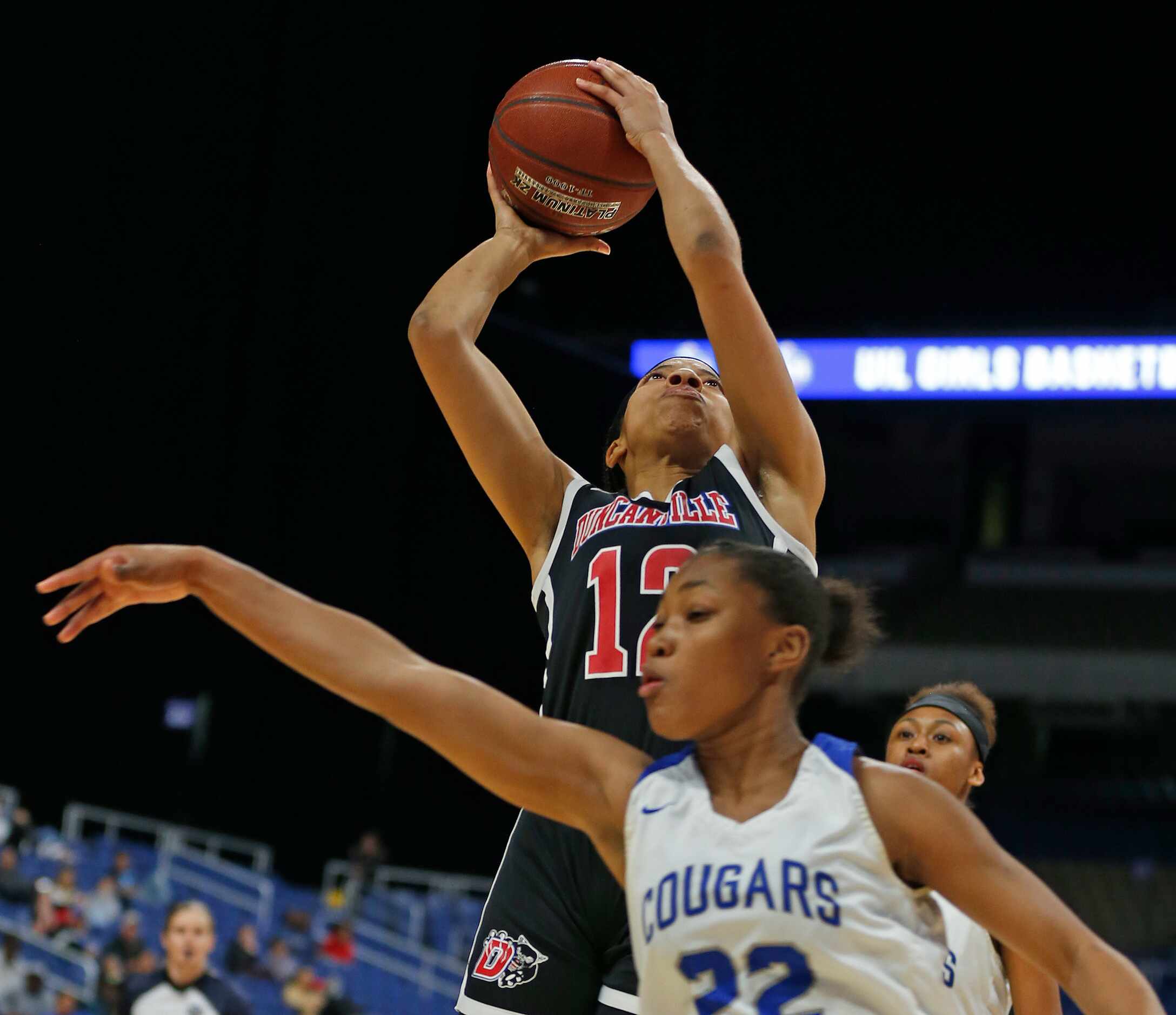 Duncanville center Zaria Rufus #12 shoots over Cypress Creek forward Kyndall Hunter #22 in a...