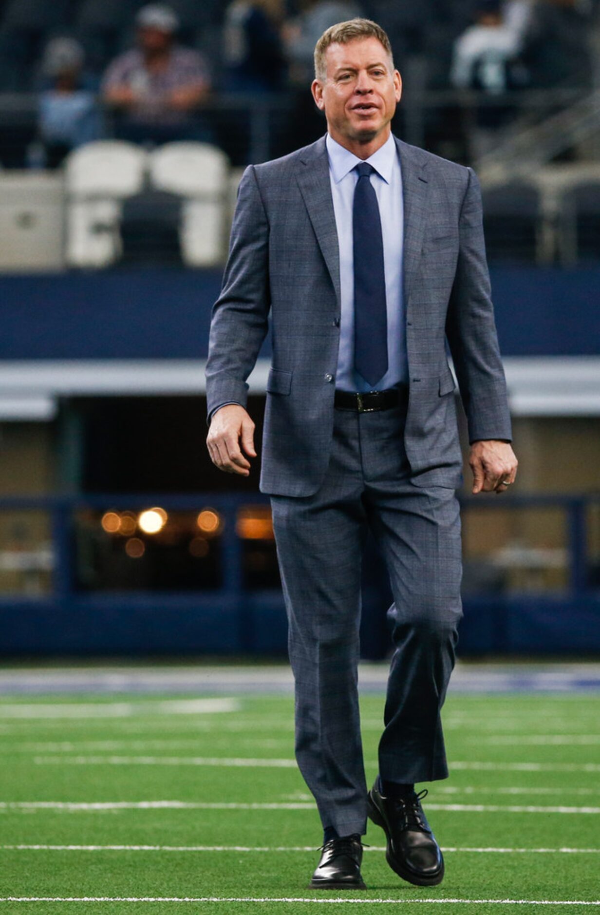 Troy Aikman walks the field prior to an NFL matchup between the Dallas Cowboys and the Los...