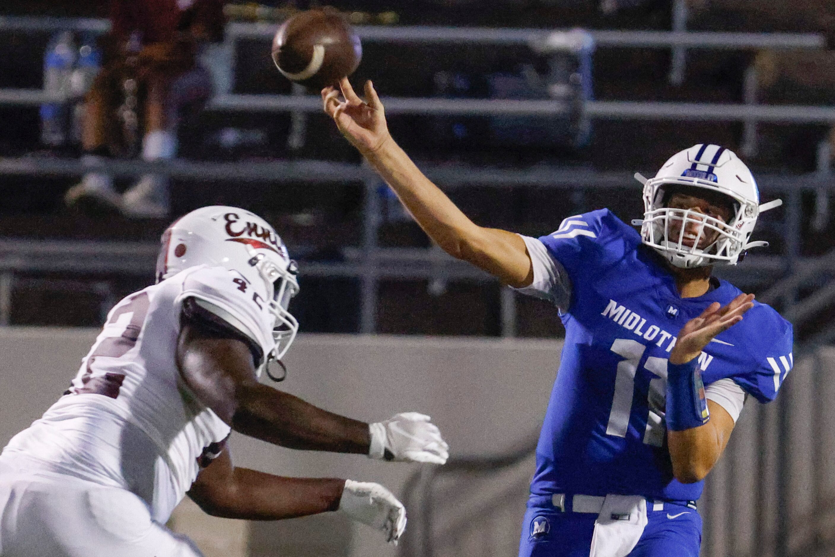 Midlothian high’s QB Drew Wendel (11) throws the ball past Ennis high school’s Kingston...