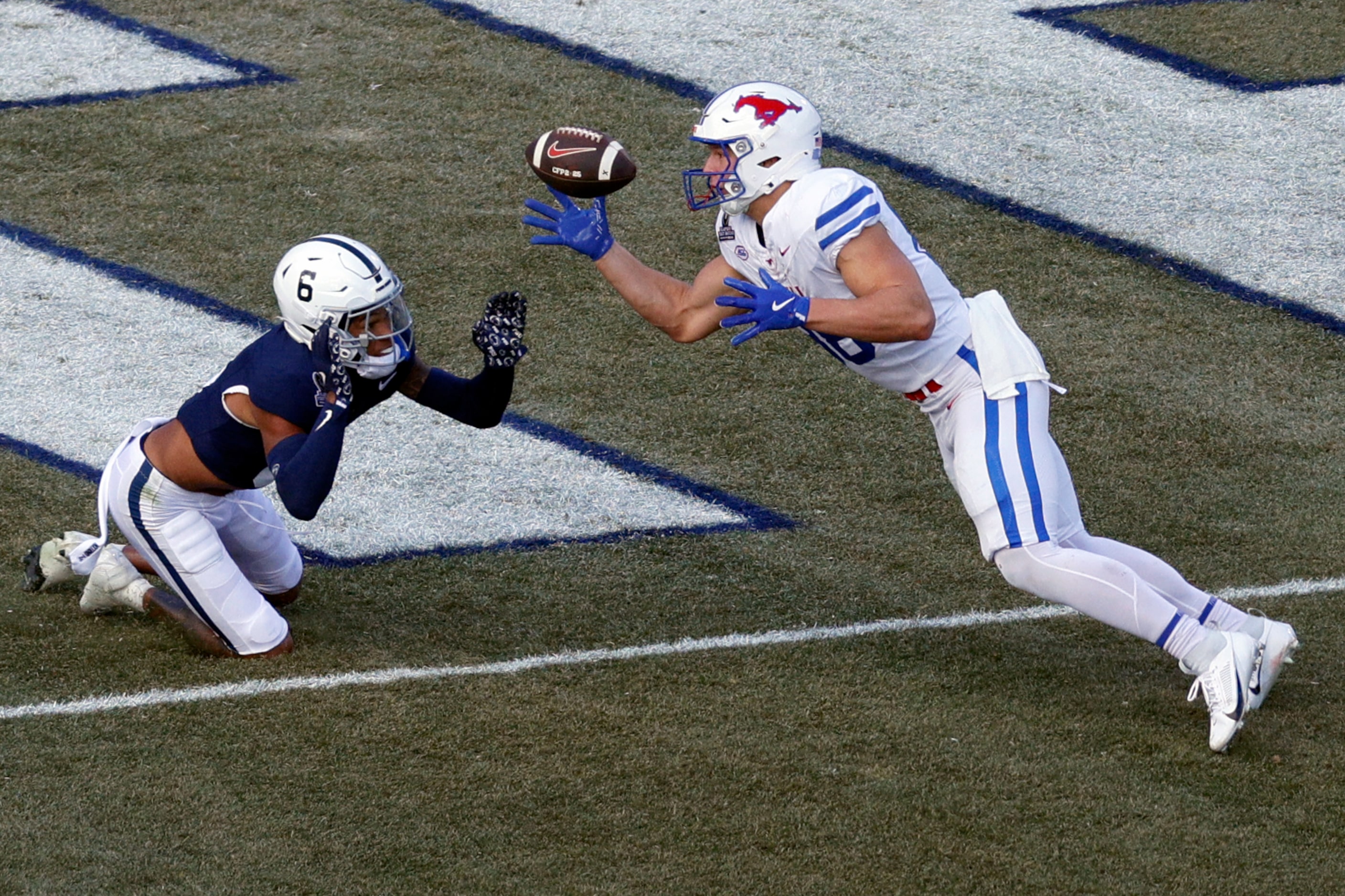 SMU tight end Matthew Hibner (88) drops a pass at the goal line ahead of Penn State safety...