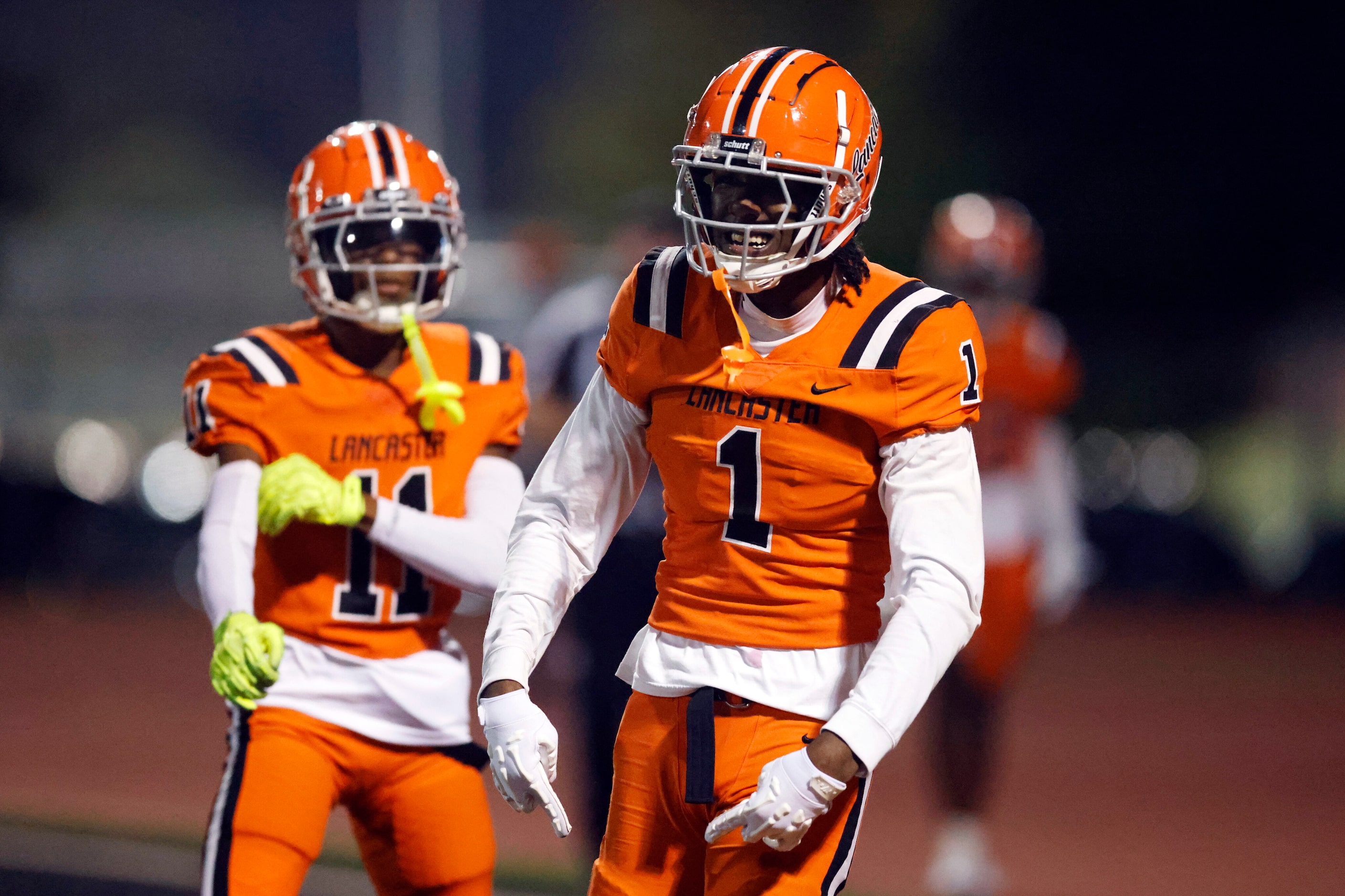 Lancaster wide receiver Emmanuel Choice (1) celebrates after scoring on a 56 yard touchdown...