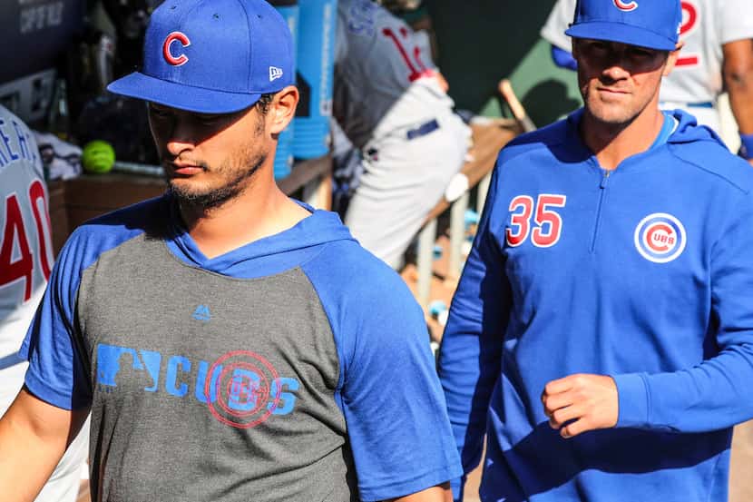Chicago Cubs' pitchers Yu Darvish (11) and Cole Hamels (35), former Rangers' pitchers leave...