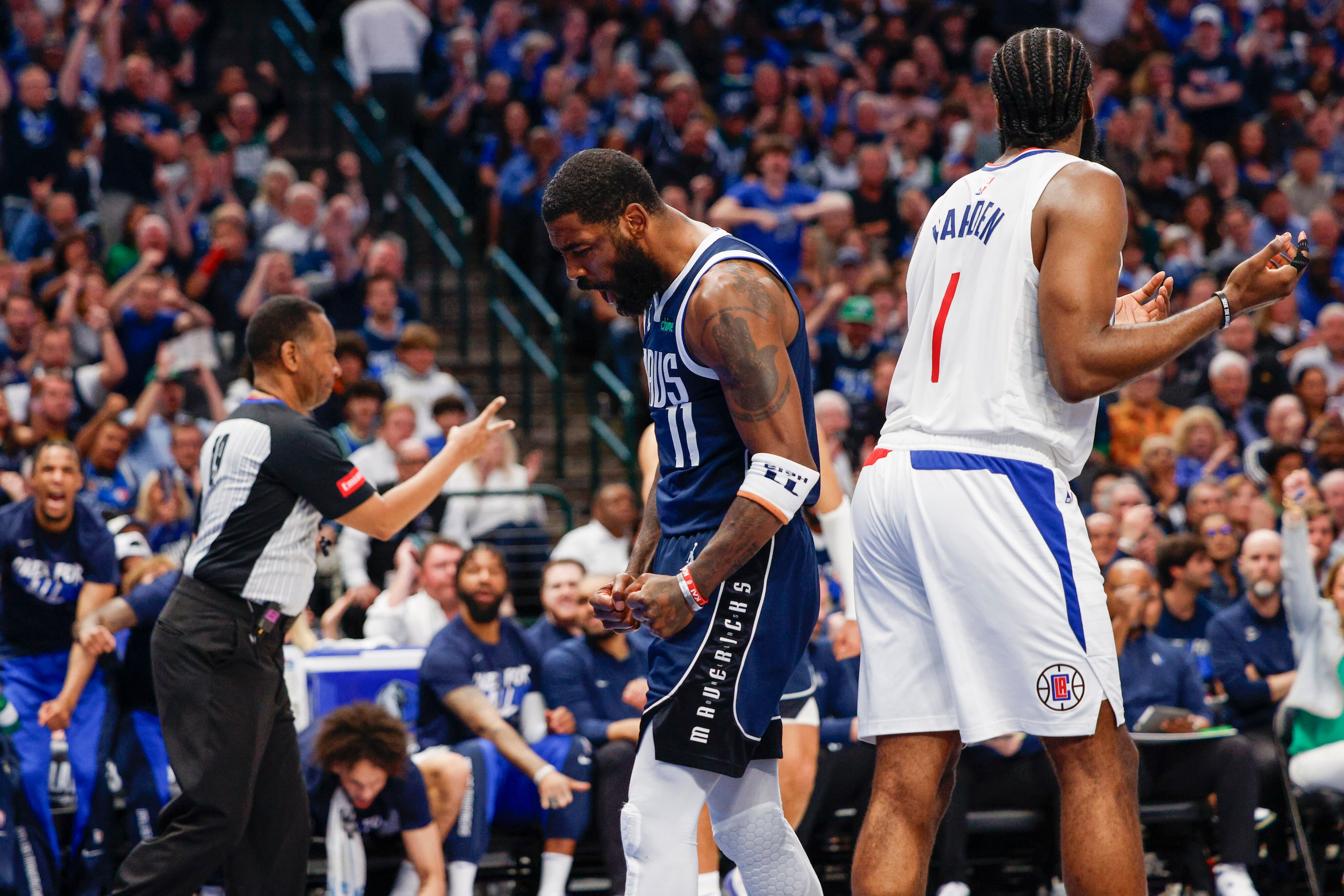 Dallas Mavericks guard Kyrie Irving (11) reacts alongside LA Clippers guard James Harden (1)...