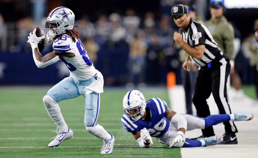 Dallas Cowboys wide receiver CeeDee Lamb (88) catches a pass along the sideline as...