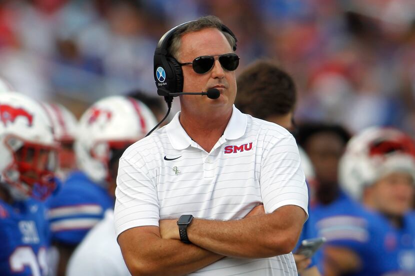 SMU head coach Sonny Dykes looks on from the team bench area during first half action...