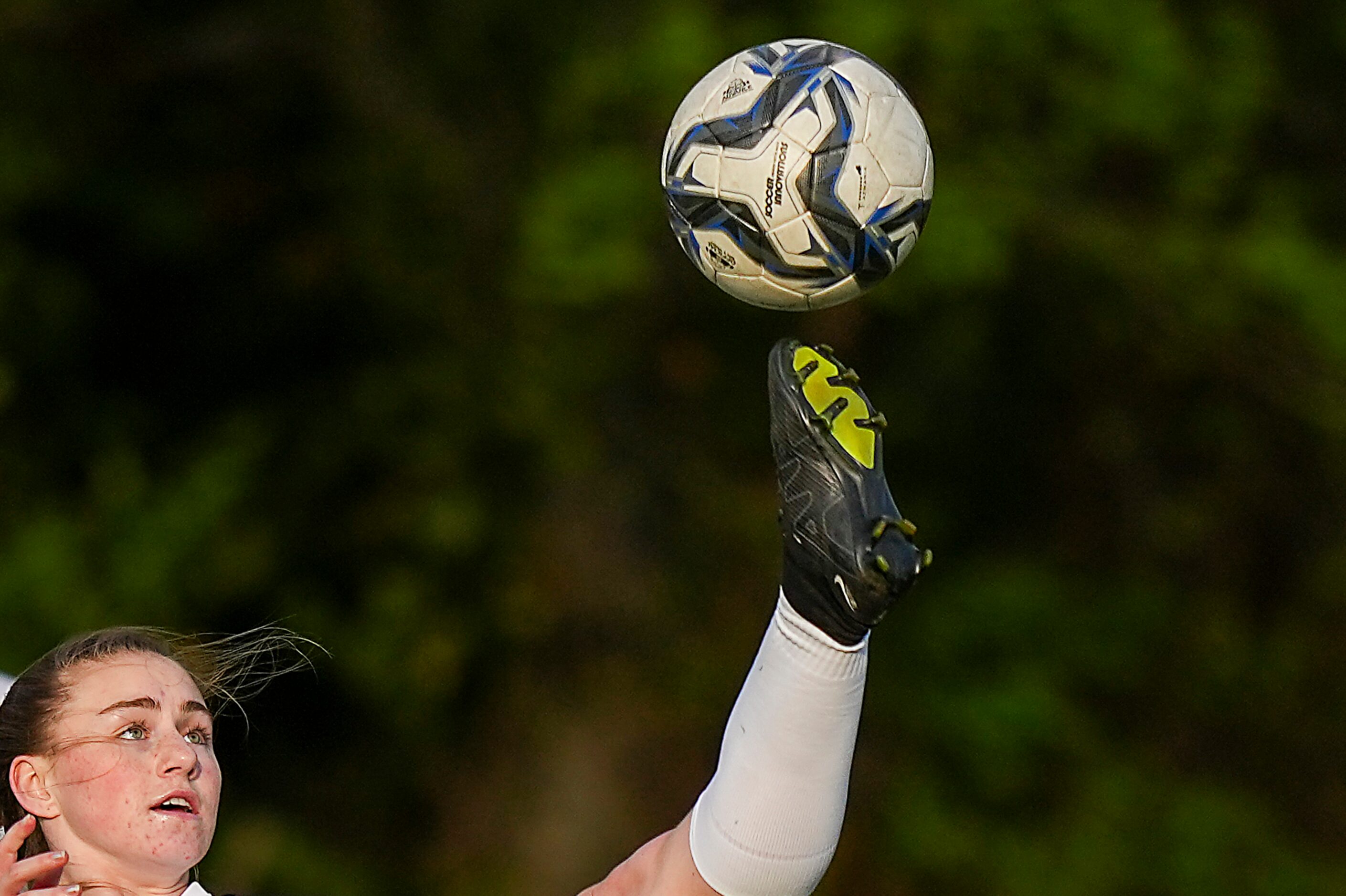 Frisco Wakeland’s Dayleigh Bos reaches high for a ball during the first half of a Class 5A...