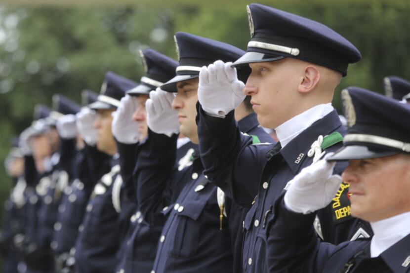 Dallas Police Office salute their fallen brethren during the 2013 Dallas Police Memorial...