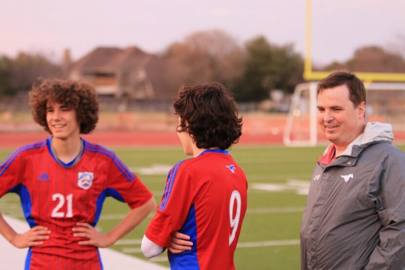 Richardson ISD's J.J. Pearce High School assistant soccer coach Tommy Lamberth, right,...