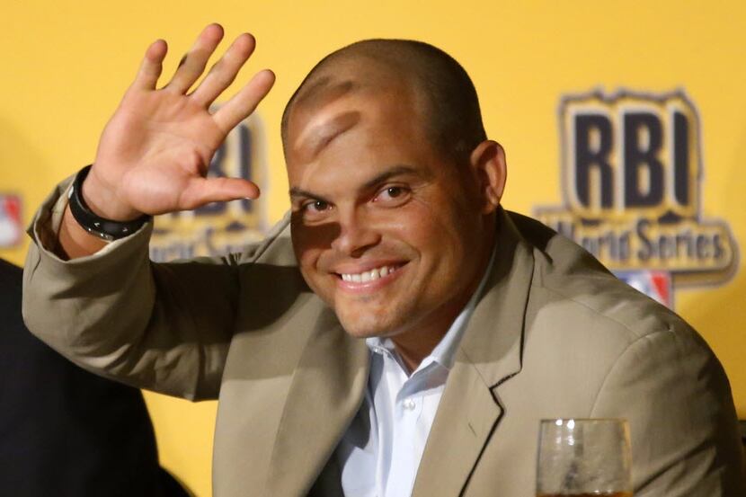 Former Texas Rangers catcher Ivan "Pudge" Rodriguez waves as he is introduced during the...