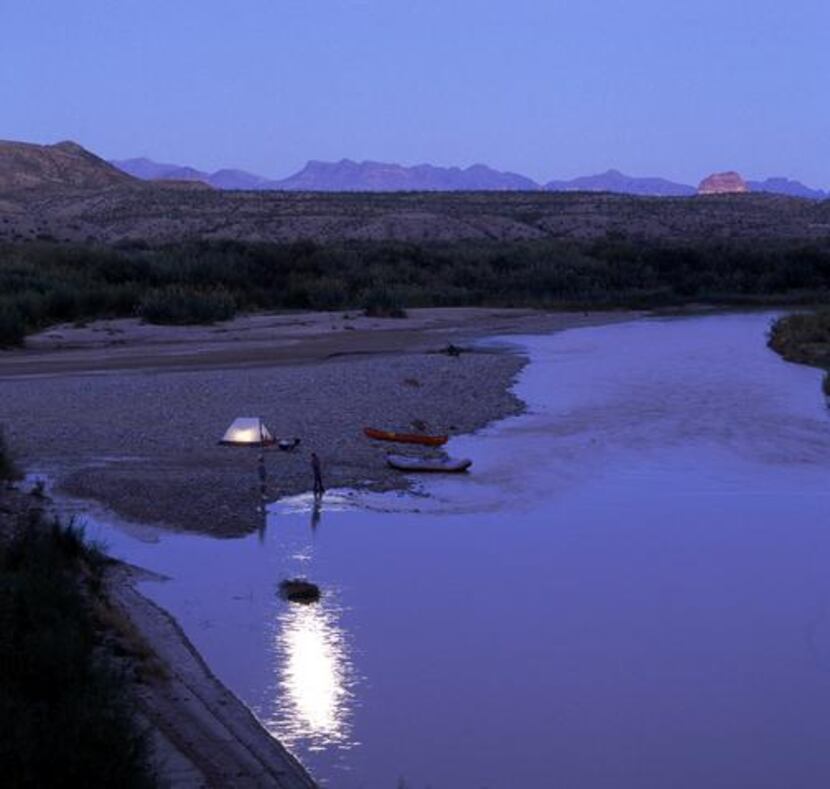 Campers tent below the mouth of Santa Elena Canyon in Big Bend National Park. (Griffis...