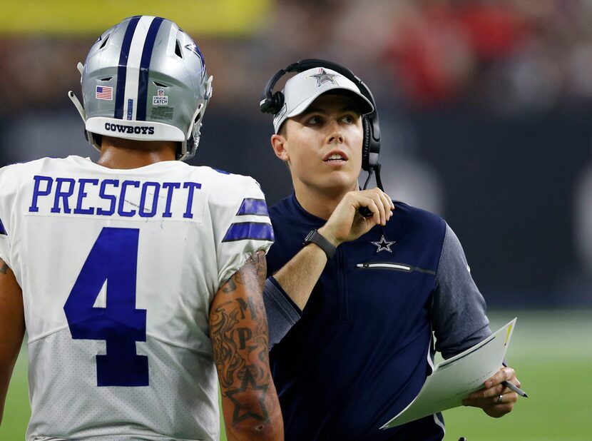 Dallas Cowboys quarterbacks coach Kellen Moore talks to Dallas Cowboys quarterback Dak...