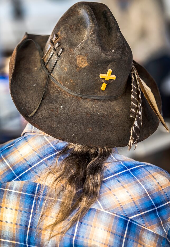 Congregation member Dennis Duncan practices singing hymns at Coke County Cowboy Church.